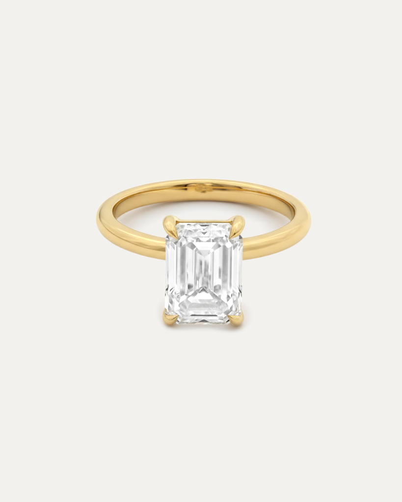 Emerald Cut Diamond Solitaire Ring — side profile, yellow gold solitaire — Stone Symphony