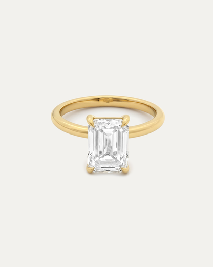 Emerald Cut Diamond Solitaire Ring — side profile, yellow gold solitaire — Stone Symphony