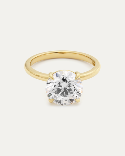 Brilliant Round Diamond Solitaire Ring — large round brilliant diamond in 4-prong yellow gold setting, studio product shot — Stone Symphony