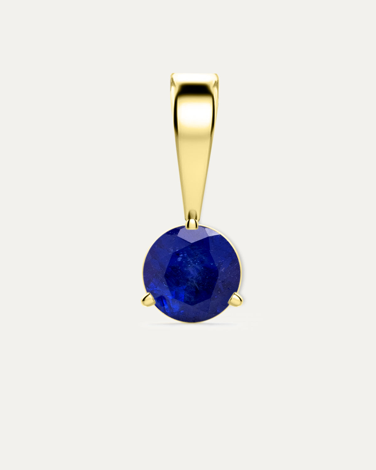 Blue Sapphire Birthstone Pendant — round deep blue sapphire in yellow gold bezel pendant with bail, studio product shot — Stone Symphony