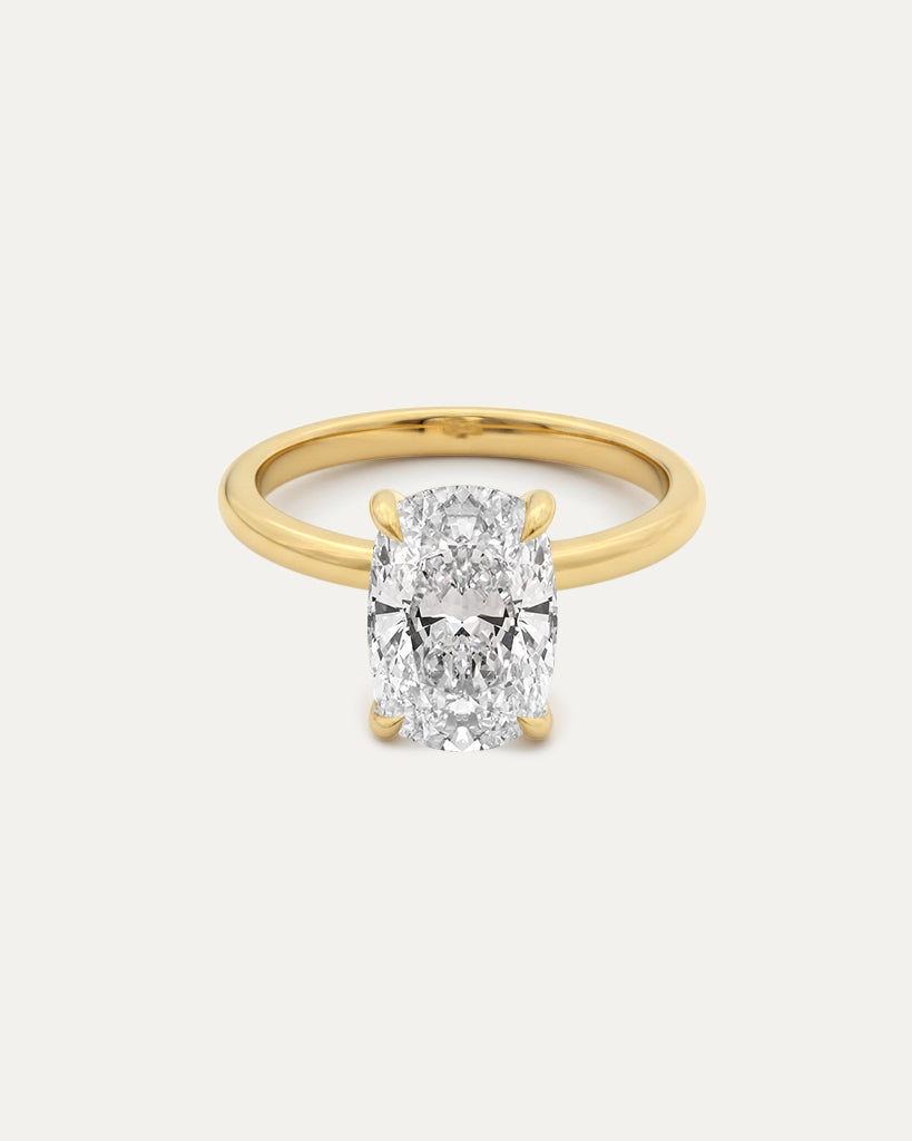 Elongated Cushion Diamond Solitaire Ring — large elongated cushion-cut diamond in 4-prong yellow gold setting, studio product shot — Stone Symphony