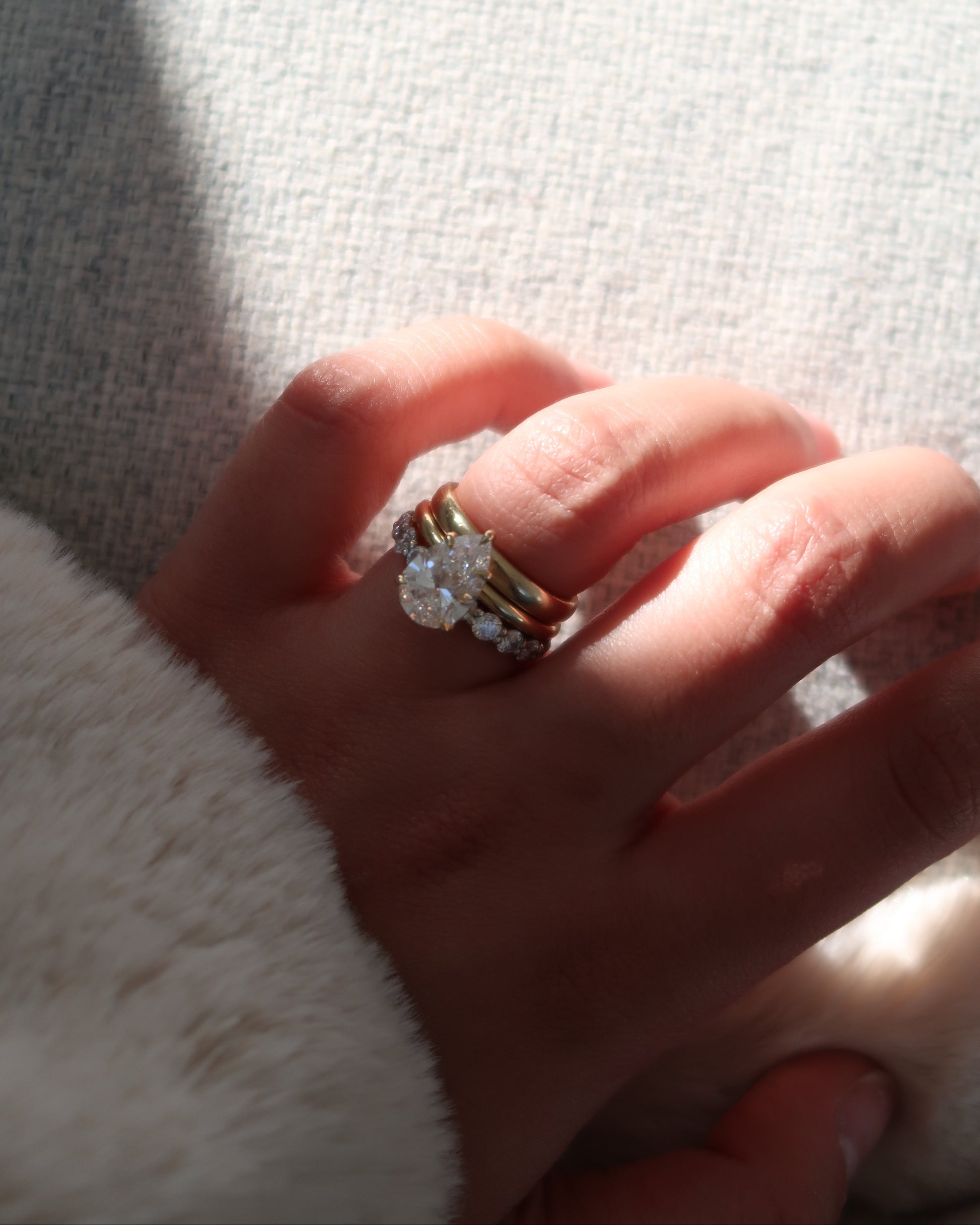 Pear Diamond Solitaire Ring on hand — tapered pear-cut diamond in yellow gold — Stone Symphony