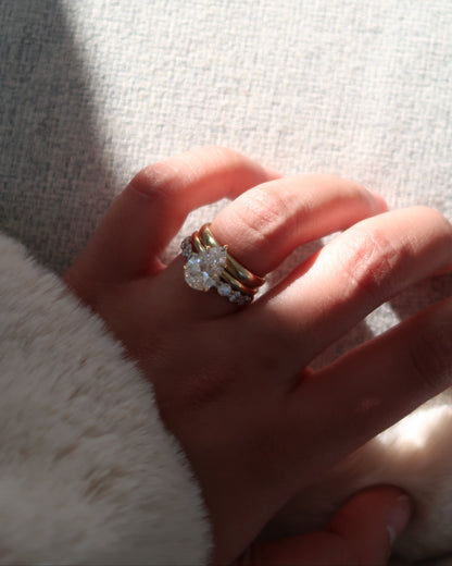 Pear Diamond Solitaire Ring on hand — tapered pear-cut diamond in yellow gold — Stone Symphony