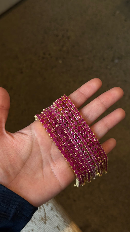 Dewdrop Ruby Tennis Bracelet close-up — deep red ruby pear-drop stones in gold — Stone Symphony