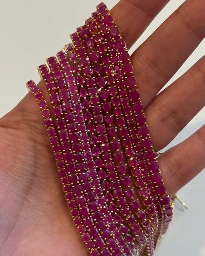 Seraphina Ruby Tennis Bracelet 18K gold vermeil lifestyle — bold ruby and gold — Stone Symphony
