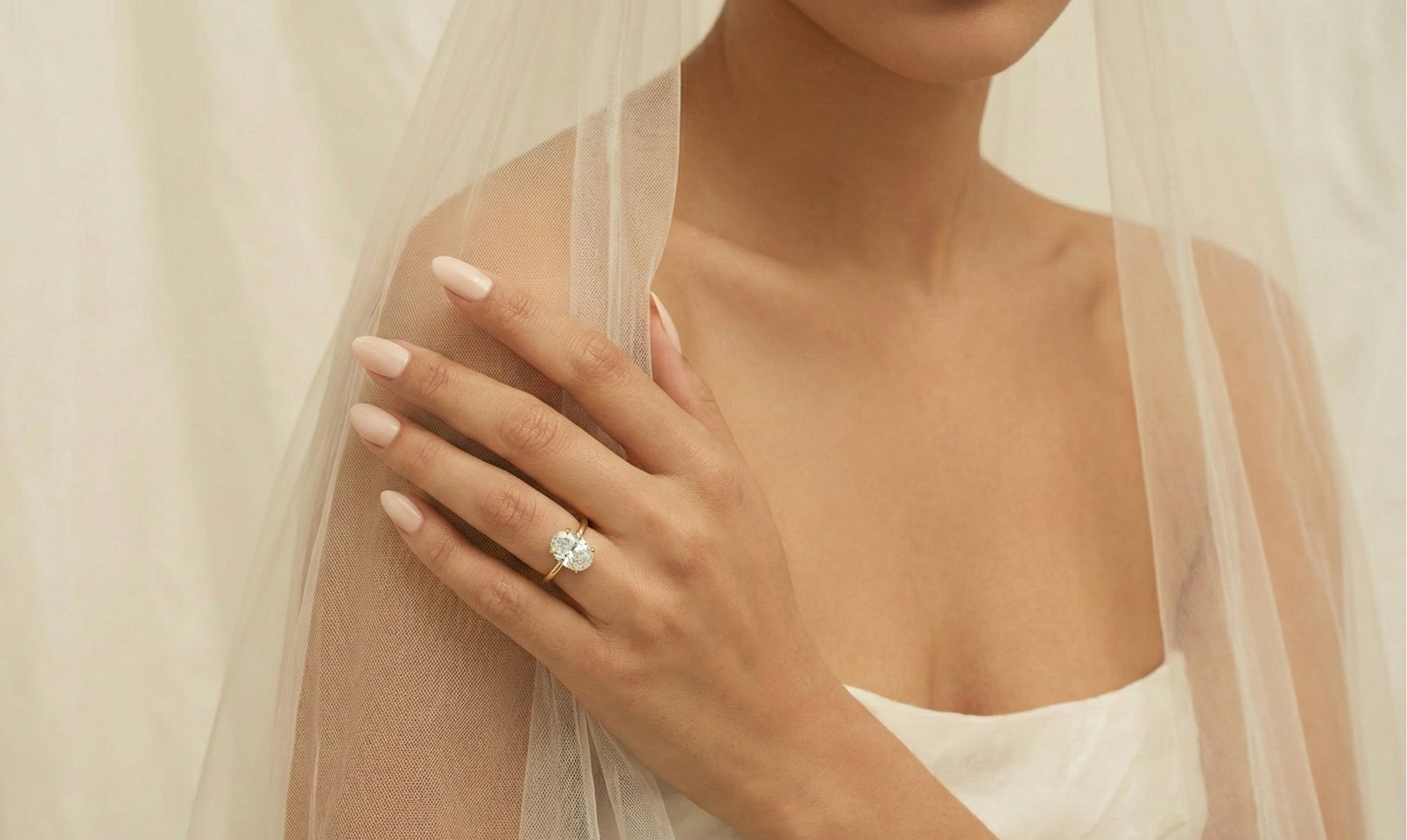 Woman wearing a wedding ring with a veil, symbolizing marriage.