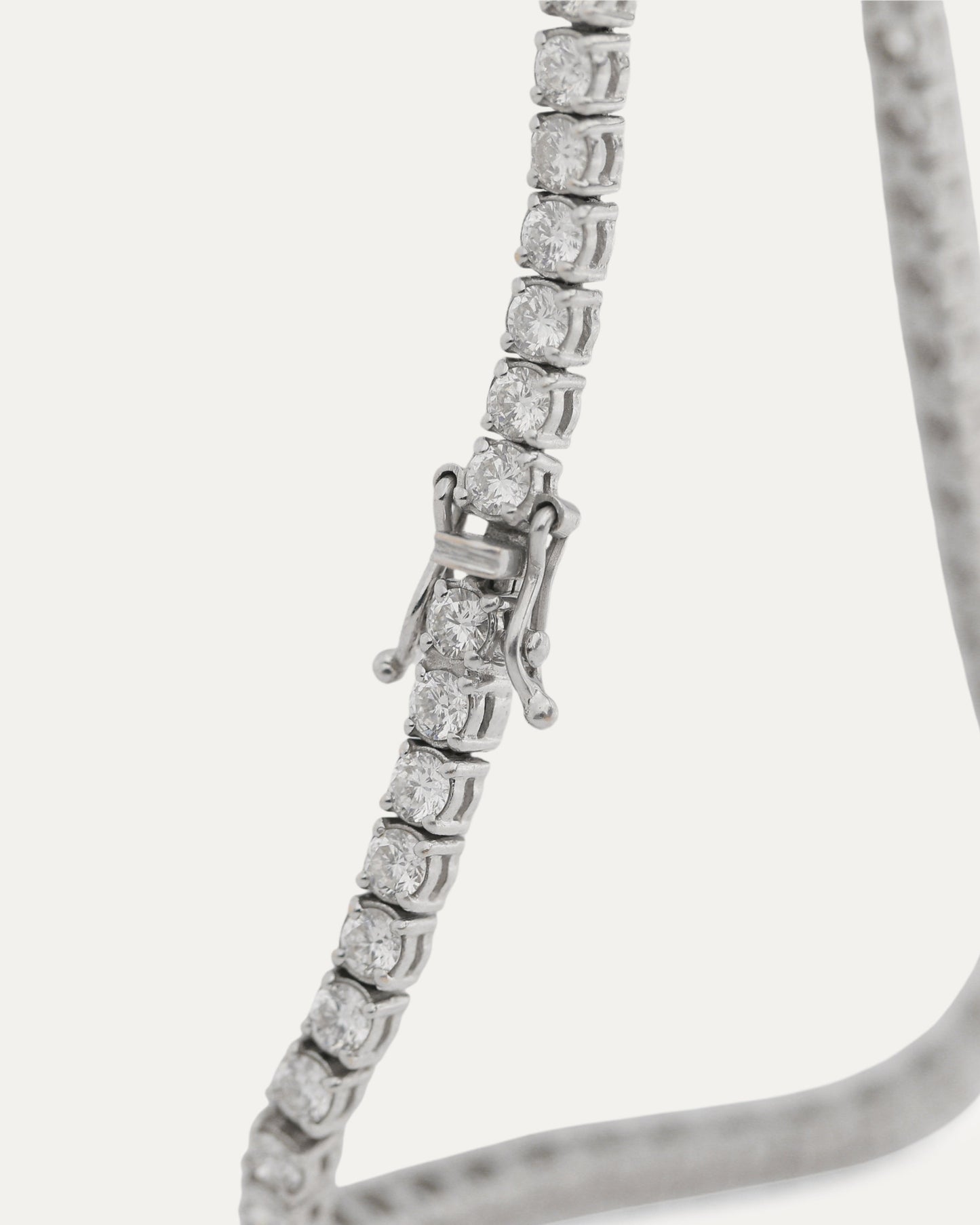 Classic Diamond Tennis Bracelet 14K white gold — close-up showing round brilliant diamonds and box clasp — Stone Symphony